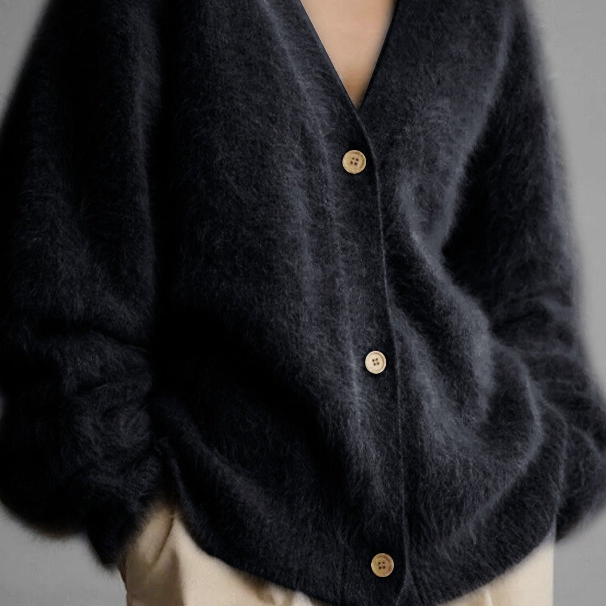 Hosszú ujjú, gombos mellény V-nyakkal