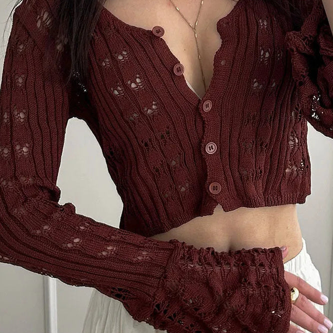 Hosszú ujjú, V-nyakú mellény áttört kötéssel