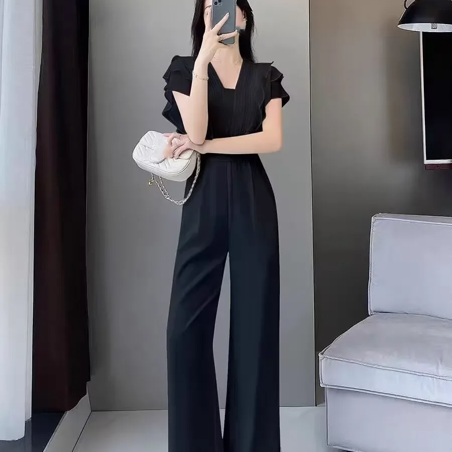 Női overál – V-nyakú – fodros ujjú – elegáns, laza szabású