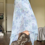 Aszimmetrikus karcsúsító szoknya virágmintás kötéssel