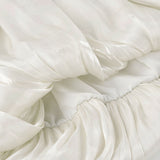 Hosszú ujjú, váll nélküli blúz egyedi dizájnnal