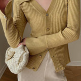 Elegáns kék V-nyakú kardigán finomkötésből