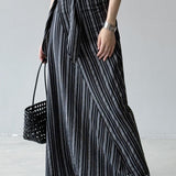 Hosszú, csíkos, magas derekú A-vonalú szoknya megkötővel