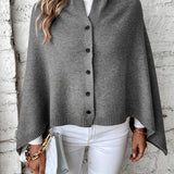 Női poncsó – puha kötésű – laza szabású – gombos záródású – bordázott felülettel