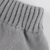 Kábelmintás kötött szoknya pomponnal