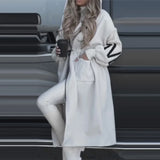 Hosszú, lezser kabát fűzőkkel és foltvarrással