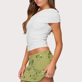 Hímzett, flitteres, testhezálló miniszoknya