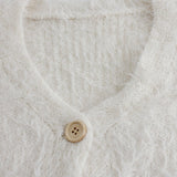 Hosszú ujjú, gombos mellény V-nyakkal