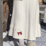 A-vonalú kötött szoknya masni díszítéssel