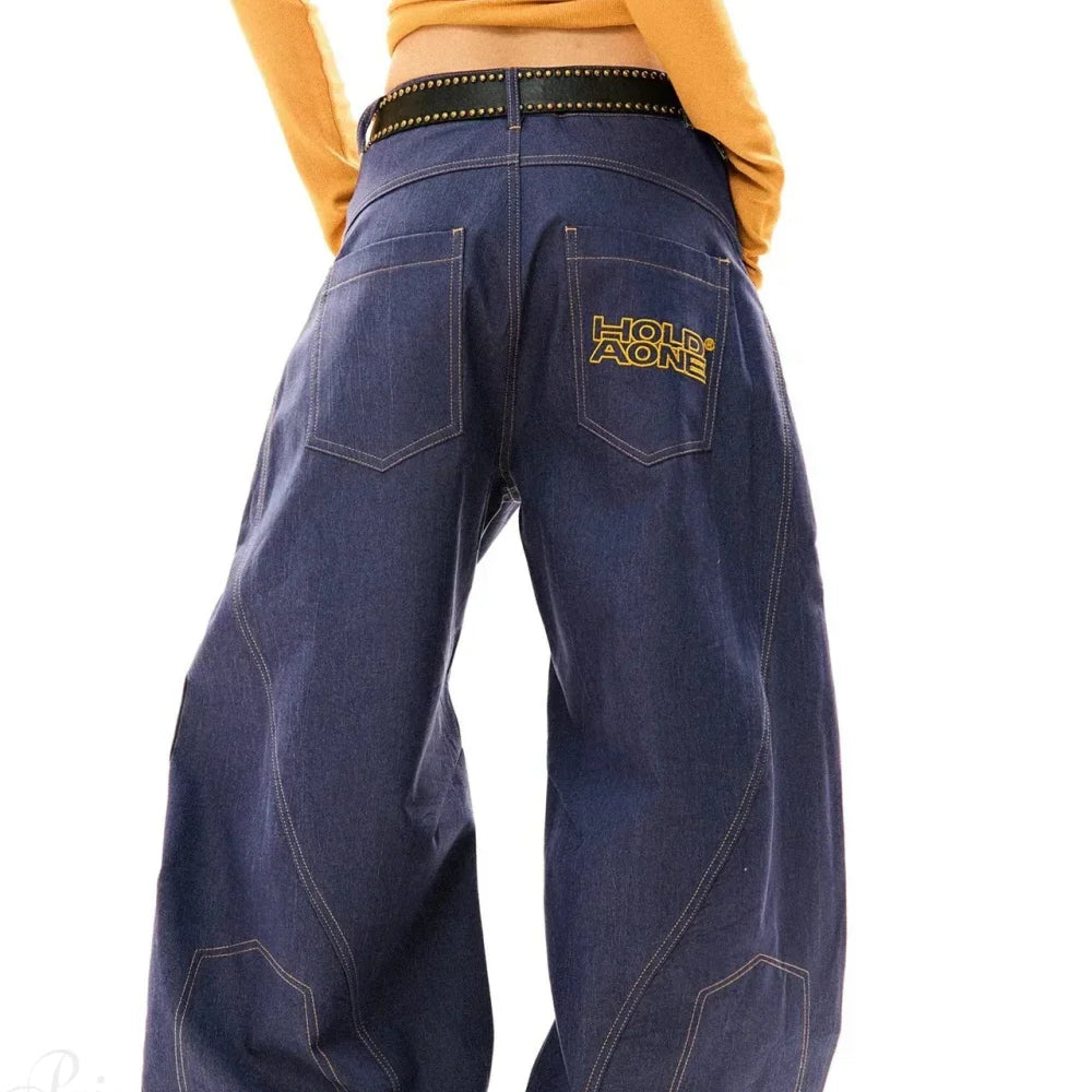 Hosszú, bő szárú, ívelt, drapézott farmernadrág