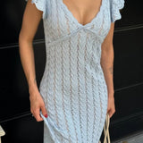 Hosszú, vidéki stílusú kötött ruha V-nyakkal és francia fodros díszítéssel