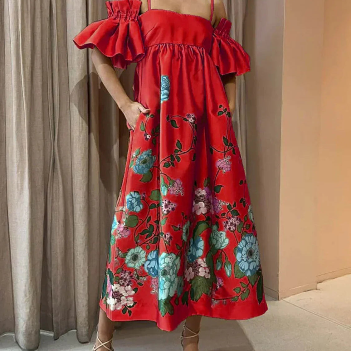 A-vonalú midi ruha ráncolt ujjakkal és elegáns zsebekkel, körömvirágmintával, zsebekkel.