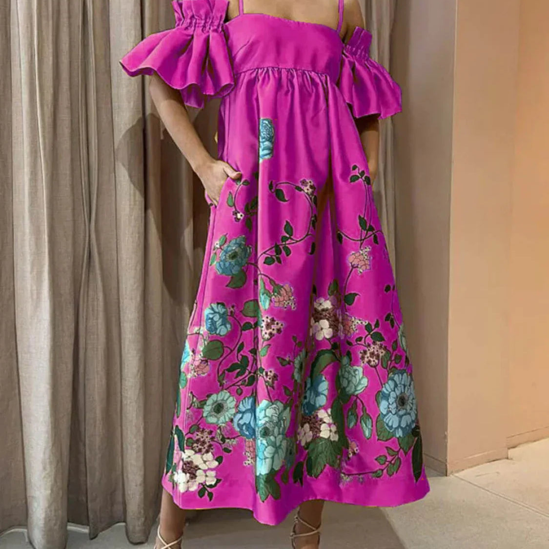 A-vonalú midi ruha ráncolt ujjakkal és elegáns zsebekkel, körömvirágmintával, zsebekkel.